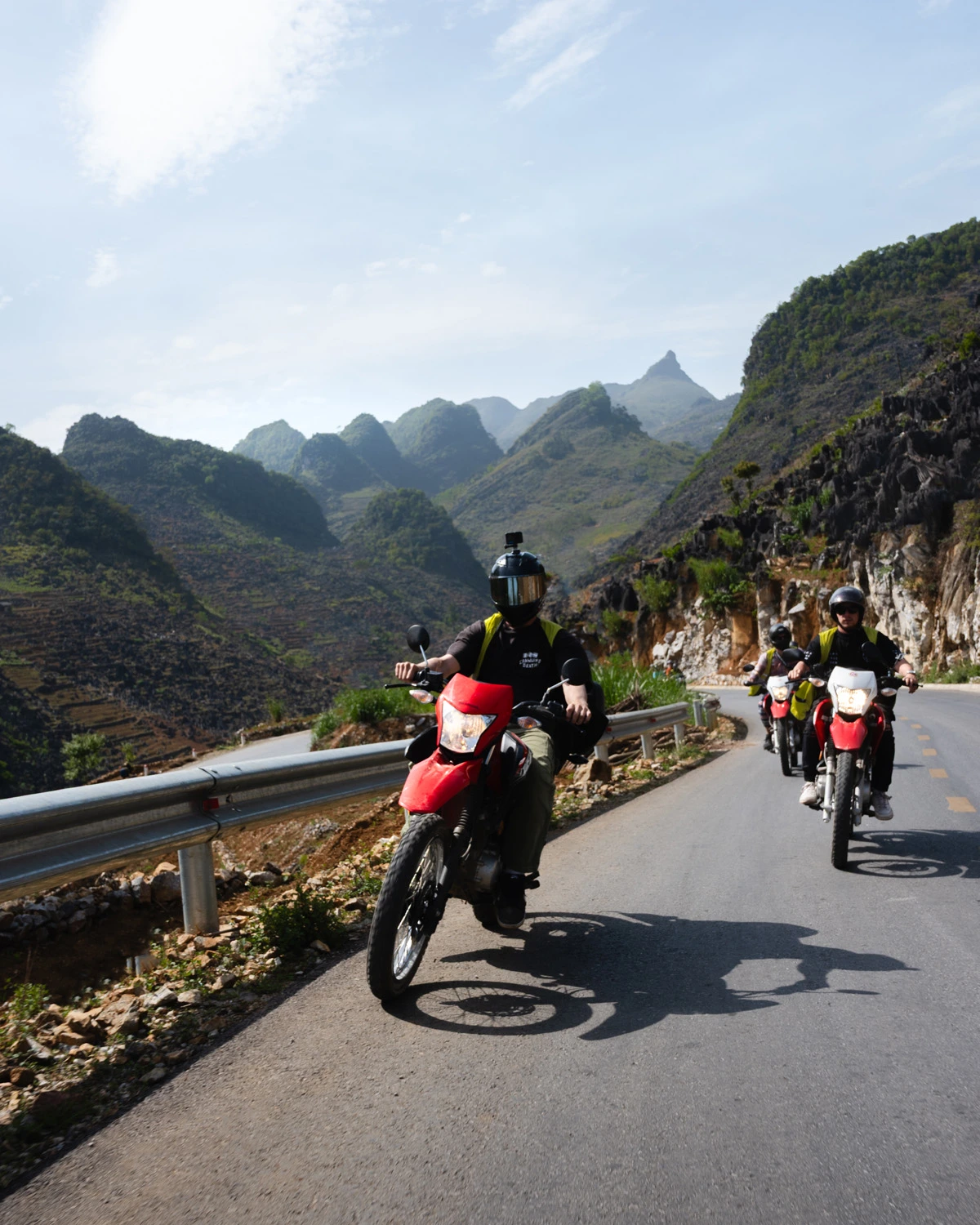Traveler riding pillion with a local easy rider guide